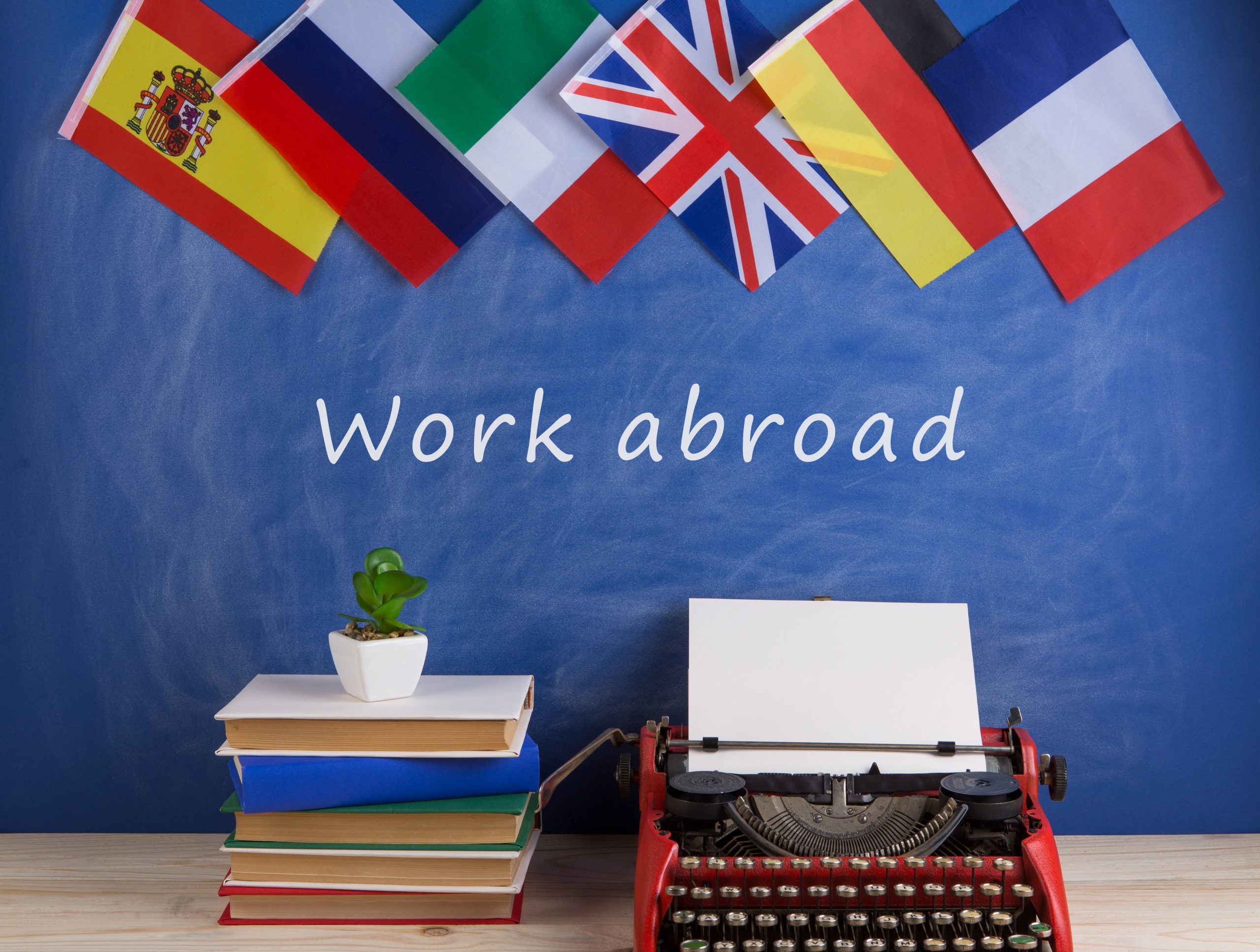 typewriter-flags-spain-france-great-britain-books-other-countries-text-work-abroad (2)-min